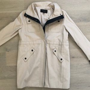 Tan trench coat with leather details